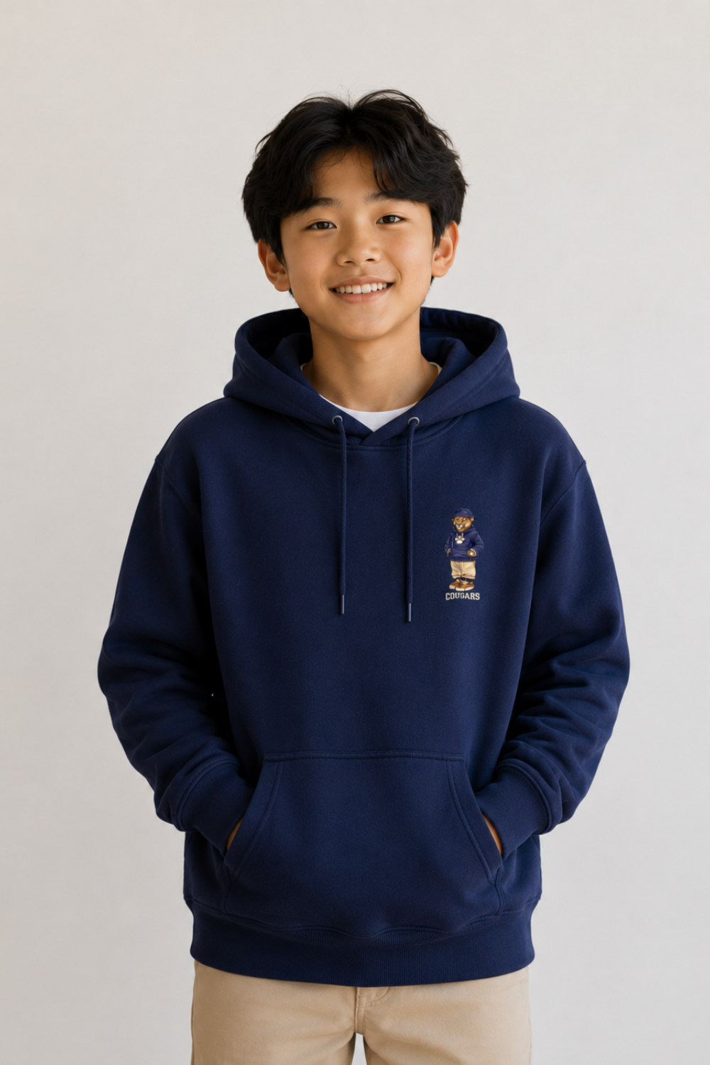 Child wearing a navy blue hoodie with a logo on a light gray background