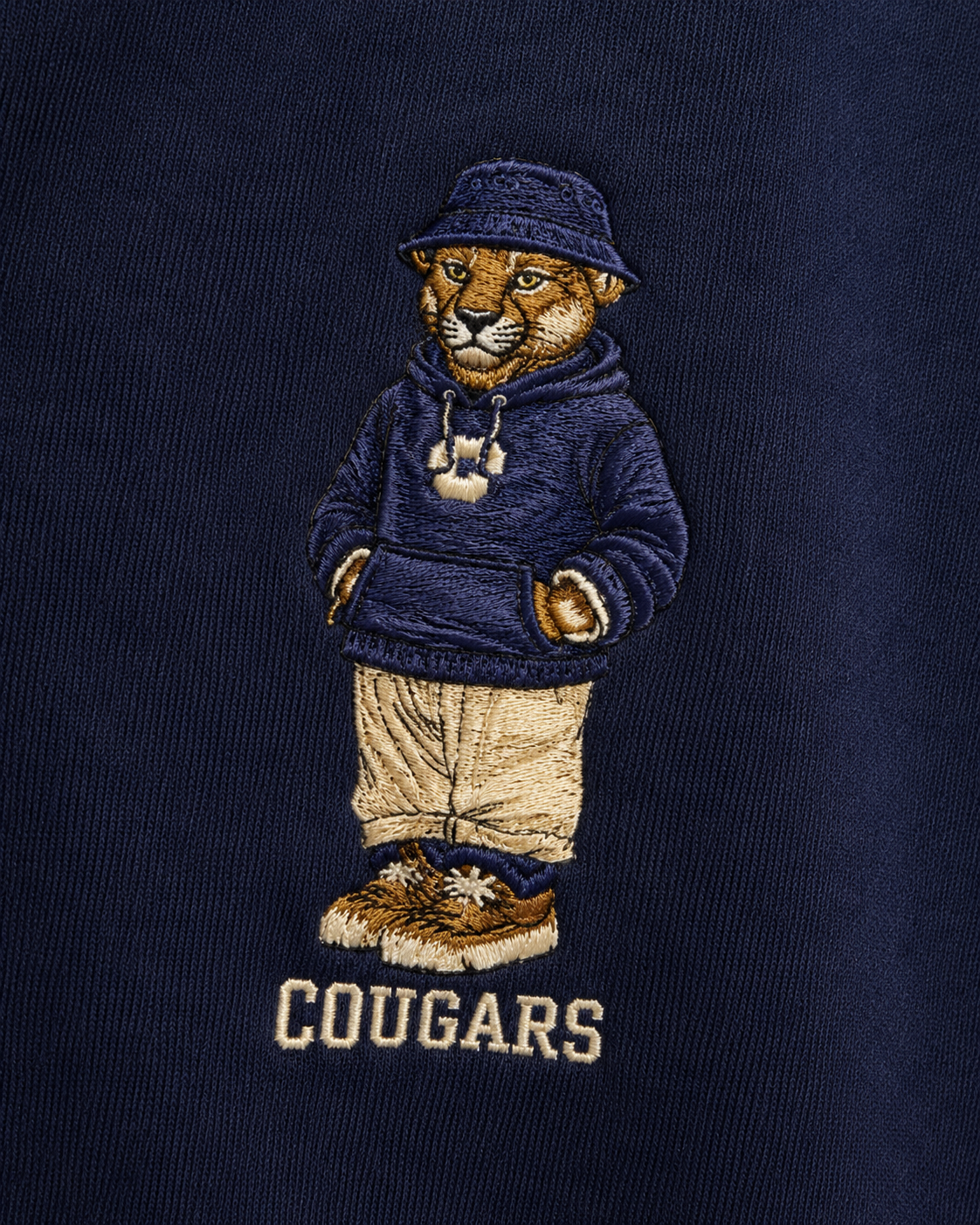 Embroidered design of a cougar wearing a hoodie on a navy background